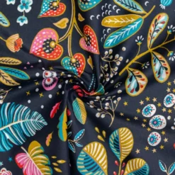 Coton enduit bleu nuit motif fleur multicolore