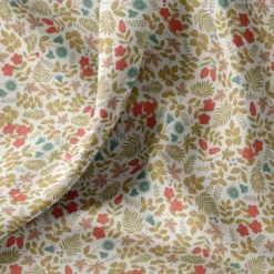 Coton enduit motif fleurs et feuilles
