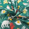 Coton vert motif animaux de la jungle et feuille tropicale papaya
