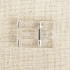 Pied universel pour fermeture à glissière invisible