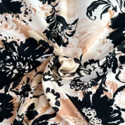 Popeline de viscose beige motif grosses fleurs noires