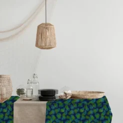 Tissu burlington bleu motif feuilles tropicales vertes