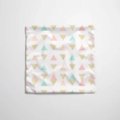 Tissu imperméable motif grands triangles pastel et paillettes