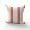 Tissu imperméable motif rayures verticales corail et beige doré