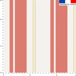 Tissu imperméable motif rayures verticales corail et beige doré