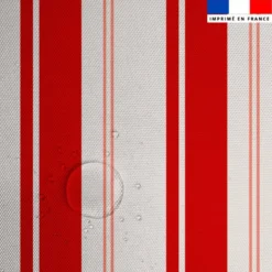 Tissu imperméable motif rayures verticales rouge et saumon