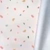 Tissu imperméable type ciré écru motif tiles