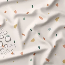 Tissu imperméable type ciré écru motif tiles