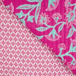 Tissu matelassé réversible motif fleurs et médaillon ethnique fuchsia