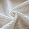 Tissu nid d'abeille blanc