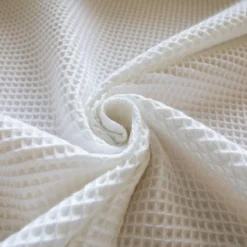 Tissu nid d'abeille blanc