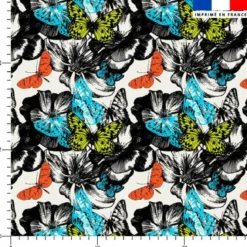 Toile coton motif papillon coloré et fleur noire